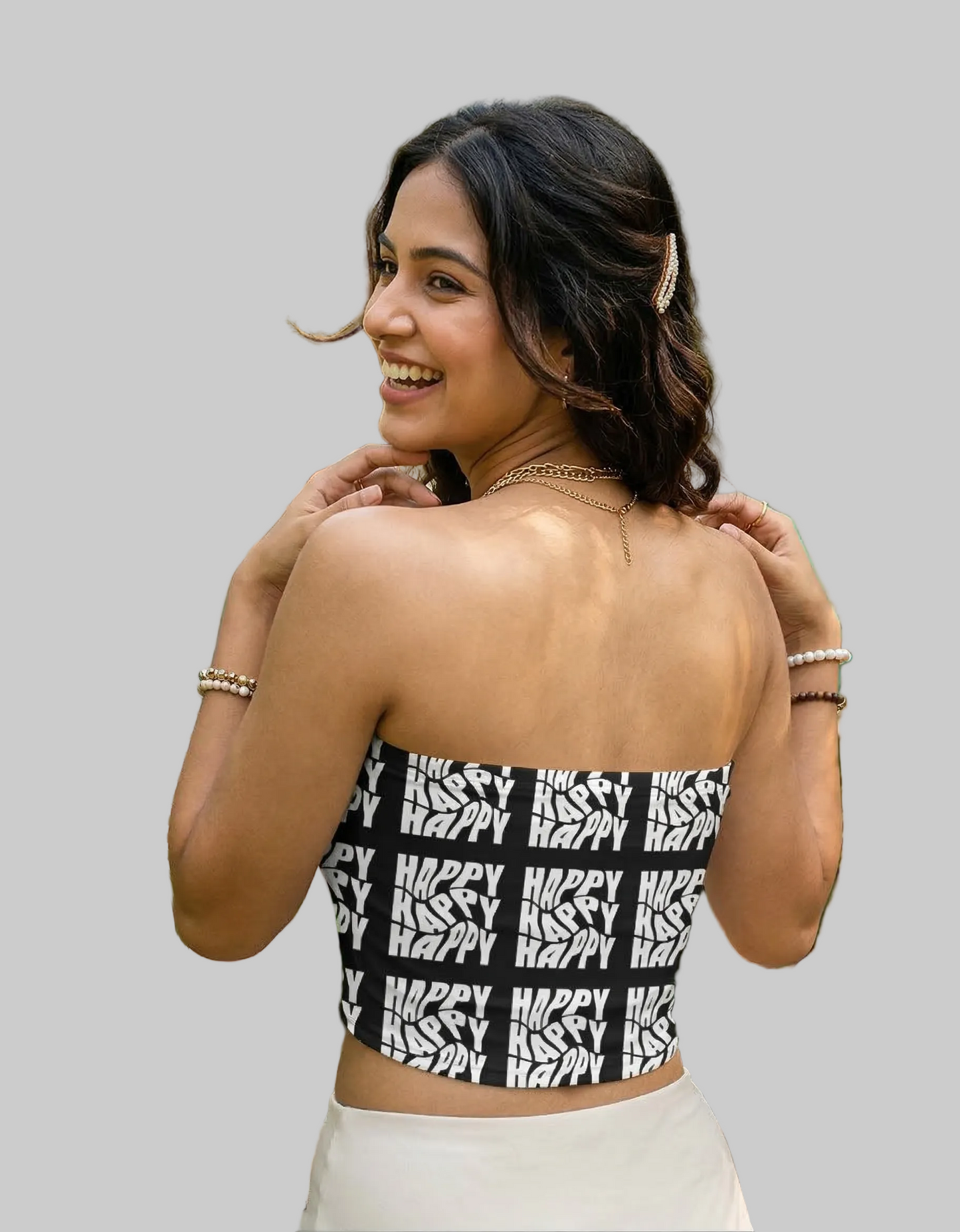 Woman wearing a black and white patterned top 