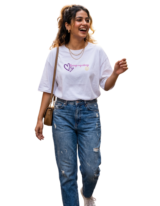 Woman wearing a white t-shirt with text and blue jeans on a white background