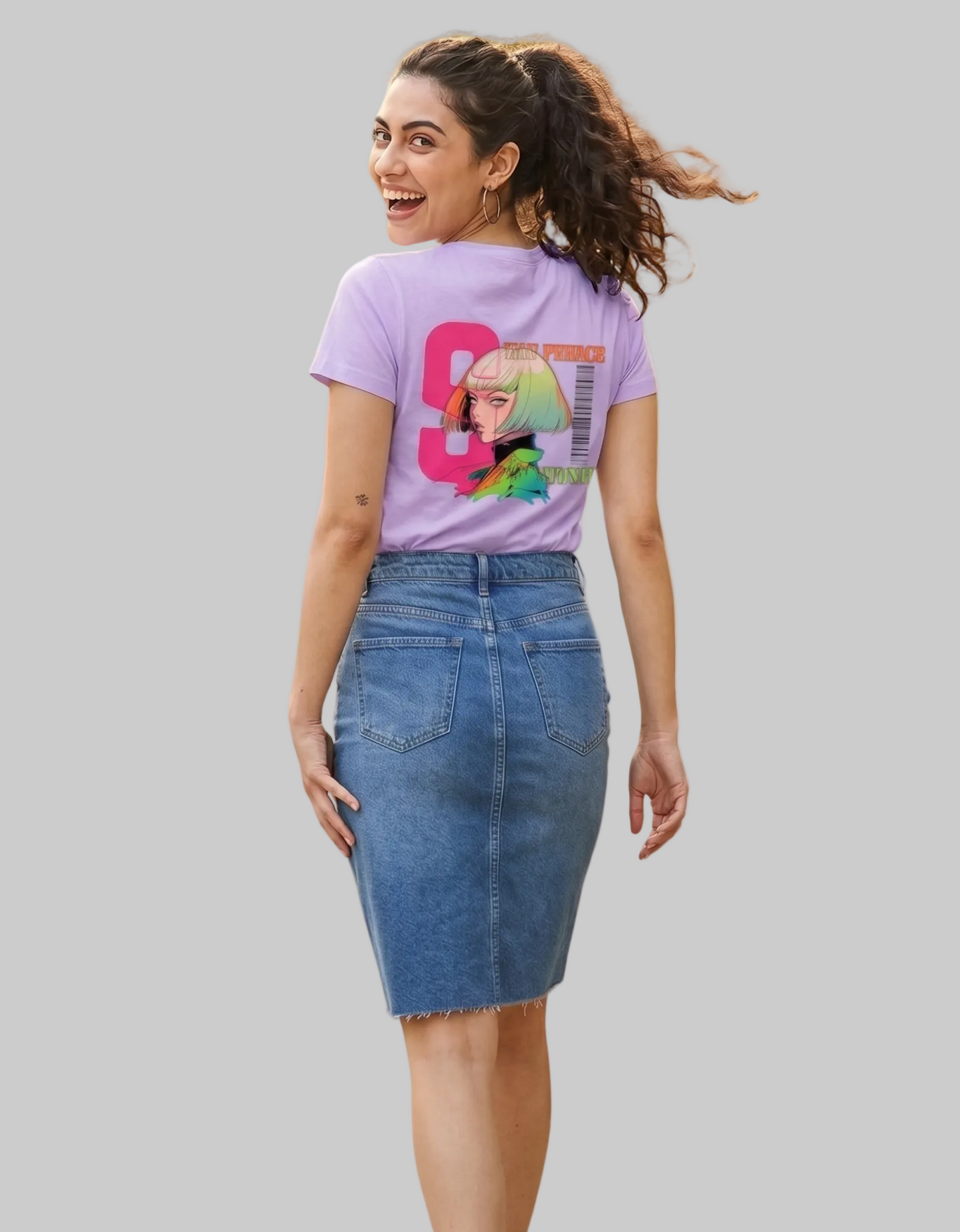 Woman wearing a purple t-shirt with a colorful anime graphic and a denim skirt on a white background