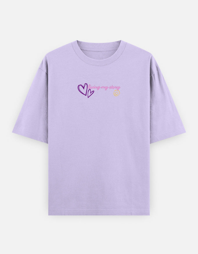 Women’s oversized anime graphic t-shirt with cute kawaii anime girl print, “Main Character Energy” back artwork, and “Living My Story” front typography in trendy Gen Z streetwear aesthetic.