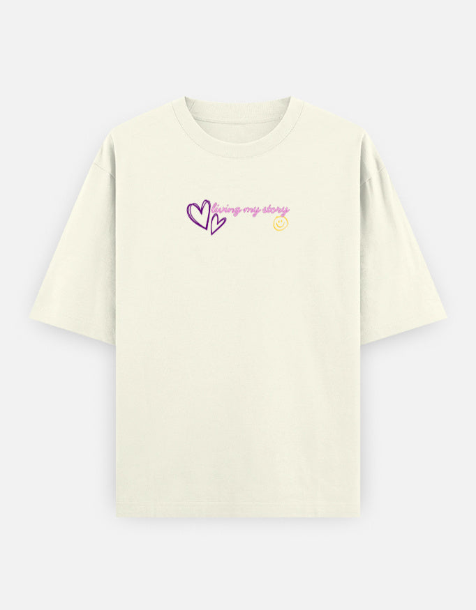 Women’s oversized anime graphic t-shirt with cute kawaii anime girl print, “Main Character Energy” back artwork, and “Living My Story” front typography in trendy Gen Z streetwear aesthetic.