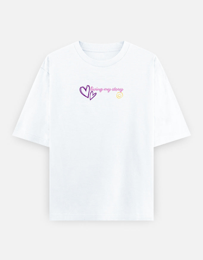 Women’s oversized anime graphic t-shirt with cute kawaii anime girl print, “Main Character Energy” back artwork, and “Living My Story” front typography in trendy Gen Z streetwear aesthetic.